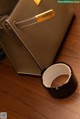 A brown purse sitting on top of a wooden table.