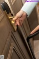 A person opening a door with a smart lock.