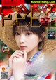 A magazine with a girl wearing a straw hat.