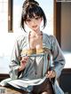 A woman in a kimono sitting on a wooden table.